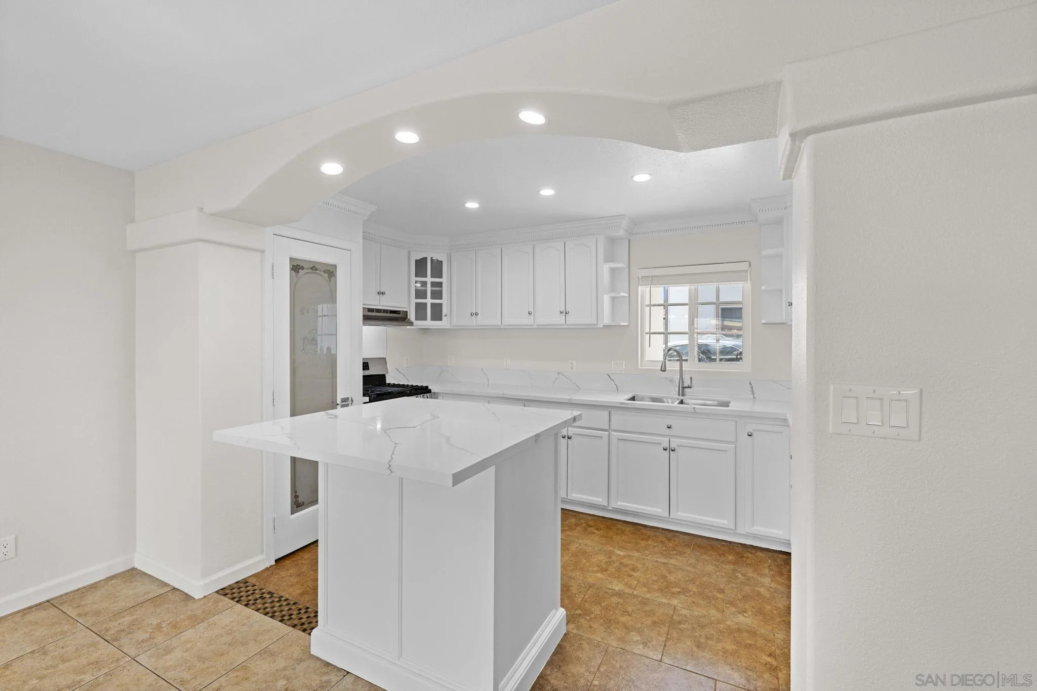 1749-51 Dahlia Avenue San Diego, CA 92154 - Photo 6 of 23 a kitchen with stainless steel appliances a sink stove and cabinets