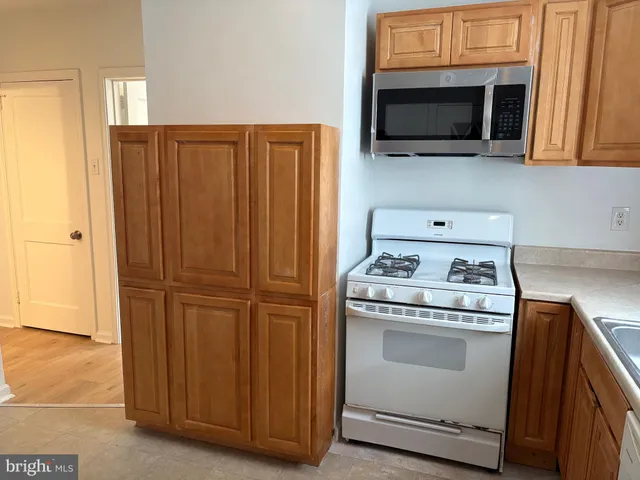a kitchen with a stove and a microwave