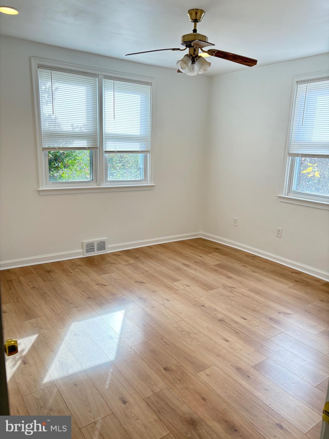 120 Overhill Avenue Philadelphia, PA 19116 - Photo 5 of 16 a view of empty room with wooden floor and fan