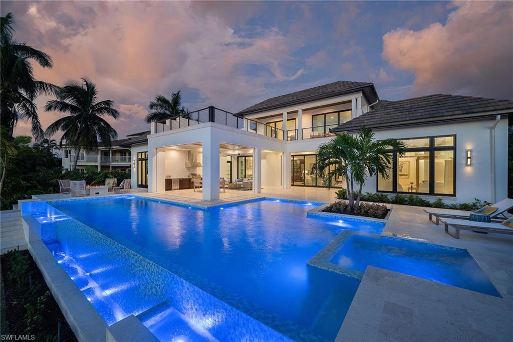 371 Hawser Lane Naples, FL 34102 - Photo 2 of 3 a view of pool with outdoor seating
