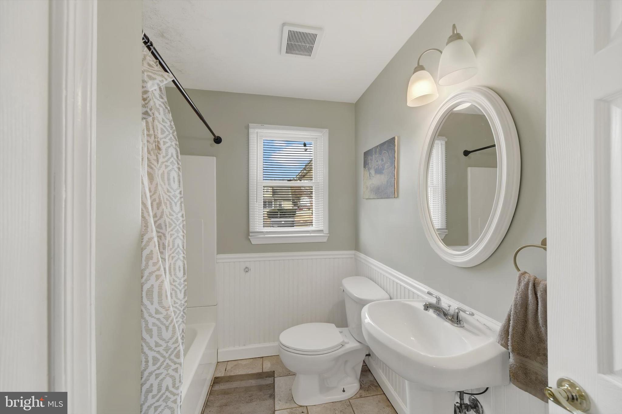 404 Homewood Road Linthicum Heights, MD 21090 - Photo 13 of 24 a bathroom with a toilet sink and mirror
