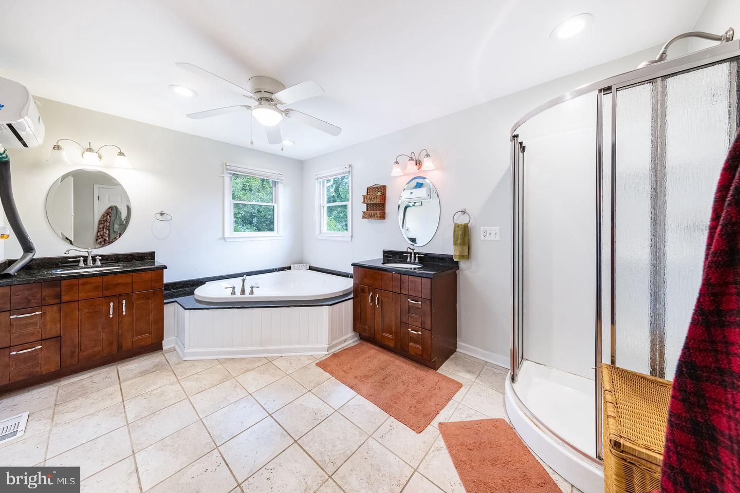 404 Homewood Road Linthicum Heights, MD 21090 - Photo 16 of 24 a spacious bathroom with a tub sink and mirror