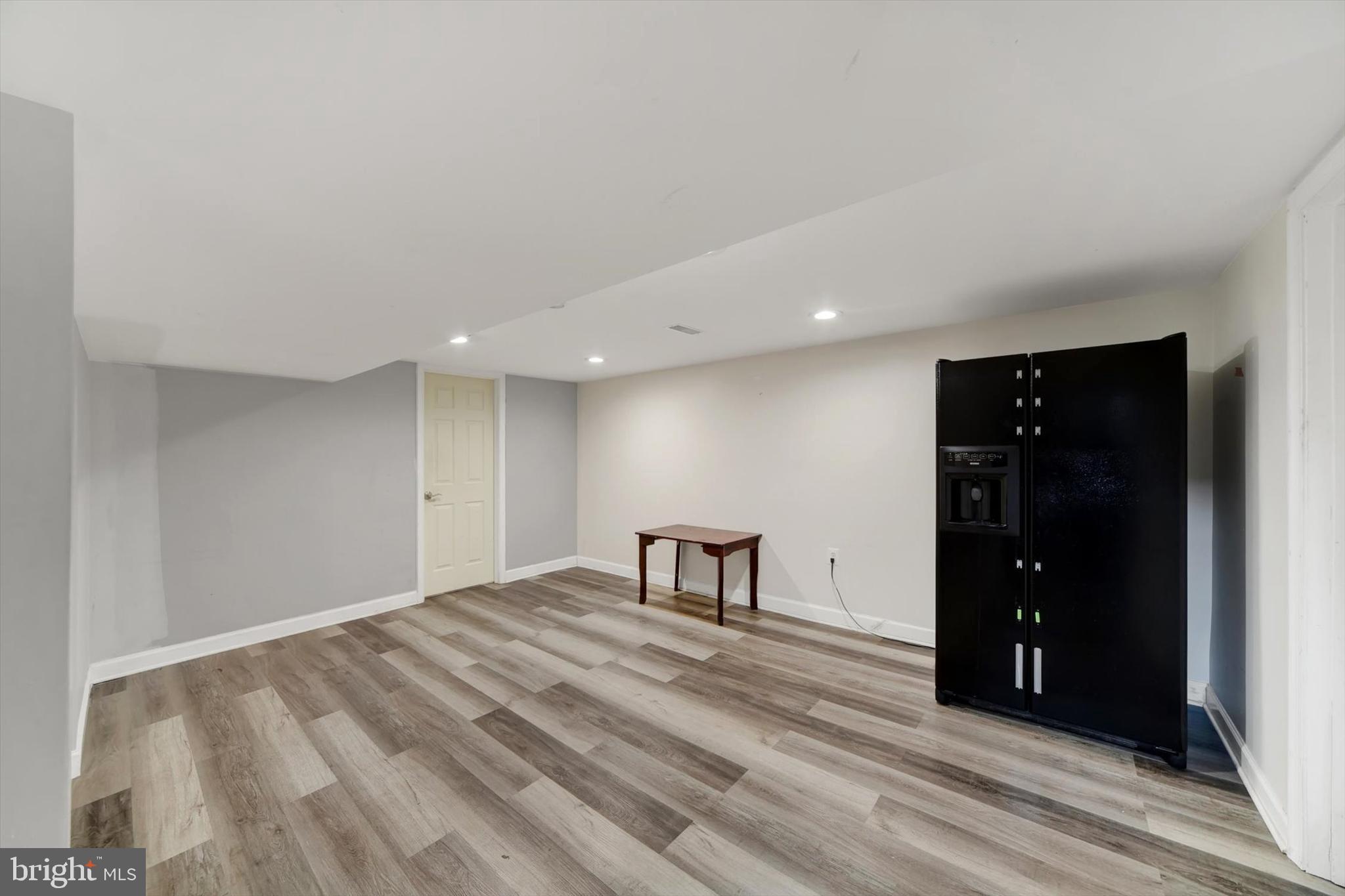 404 Homewood Road Linthicum Heights, MD 21090 - Photo 21 of 24 a view of a room with wooden floor and closet