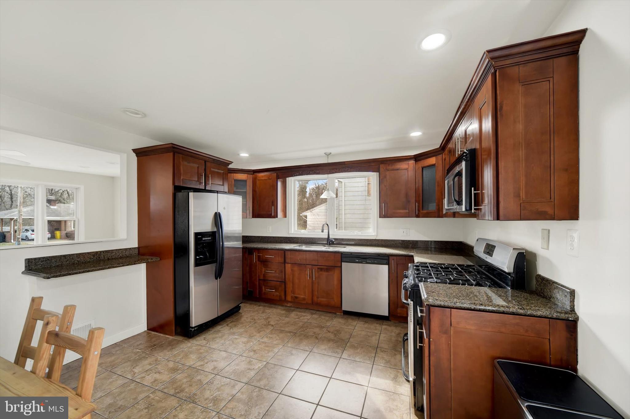 404 Homewood Road Linthicum Heights, MD 21090 - Photo 10 of 24 a kitchen with stainless steel appliances granite countertop a refrigerator stove and sink