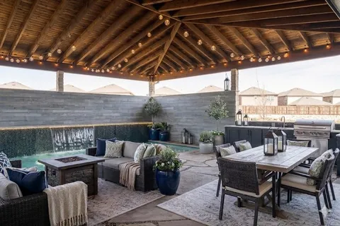 a view of a patio with couches and potted plants