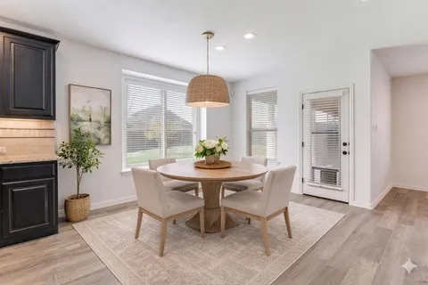 a dining room with furniture window wooden floor