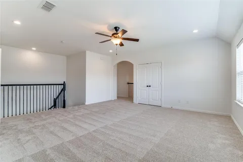 en view interior of a house with a ceiling fan and window
