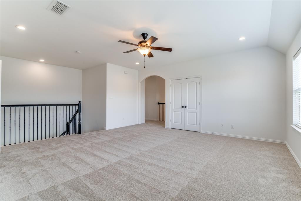 1215 Hundgate Way Forney, TX 75126 - Photo 24 of 38 Uptirs gameroom featuring carpet, recessed lighting, ceiling fan, arched walkways, and vaulted ceiling