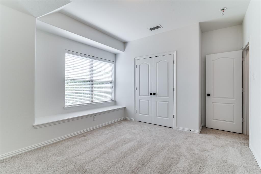 1215 Hundgate Way Forney, TX 75126 - Photo 32 of 38 Upstairs bedroom #3 featuring light colored carpet and a closet