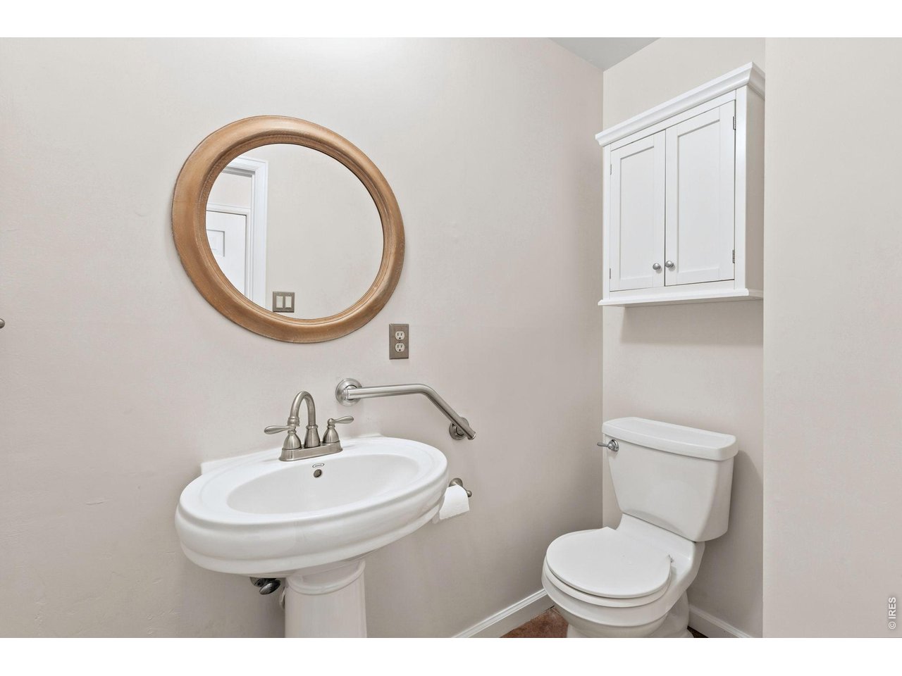 2121 18th Street Road Greeley, CO 80631 - Photo 17 of 40 Updated main floor powder room is right off the kitchen, garage and family room.