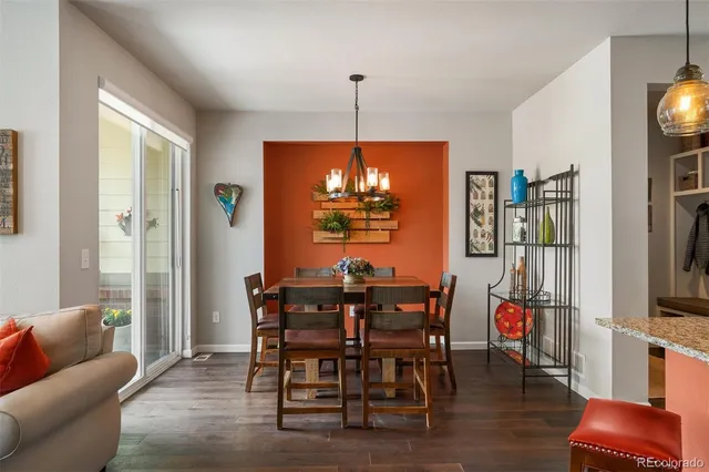 a dining room with furniture and window