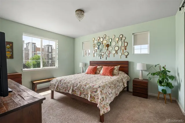 a bedroom with a bed and a couch