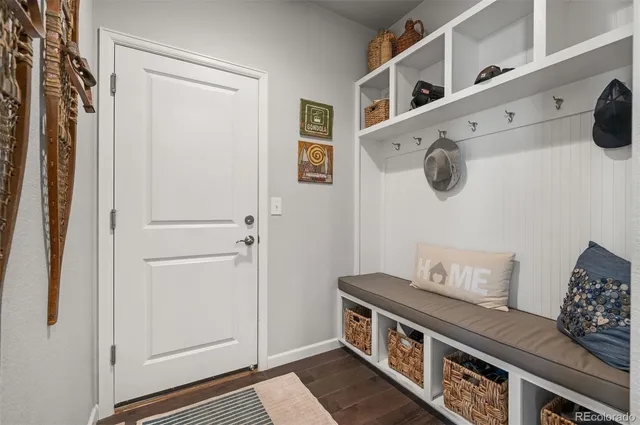 a view of an entryway with wooden floor