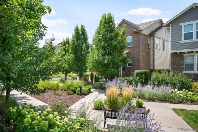 a view of backyard with outdoor seating and green space