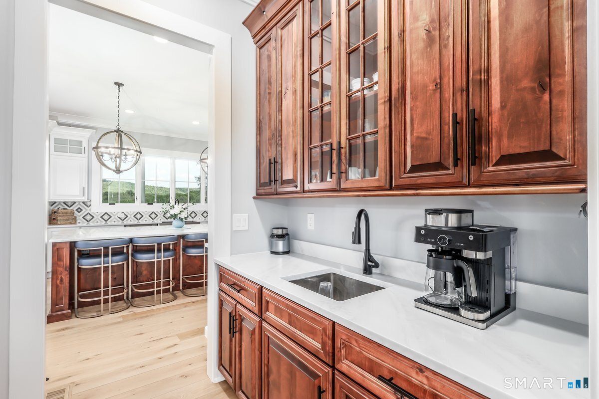 2 Pond View Lane Sherman, CT 06784 - Photo 16 of 40 a kitchen with stainless steel appliances a sink a stove and cabinets