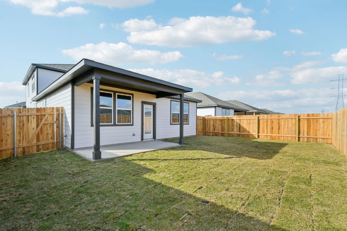 13413 Derby Ride Drive Buda, TX 78610 - Photo 29 of 36 a big house with a big yard and large trees