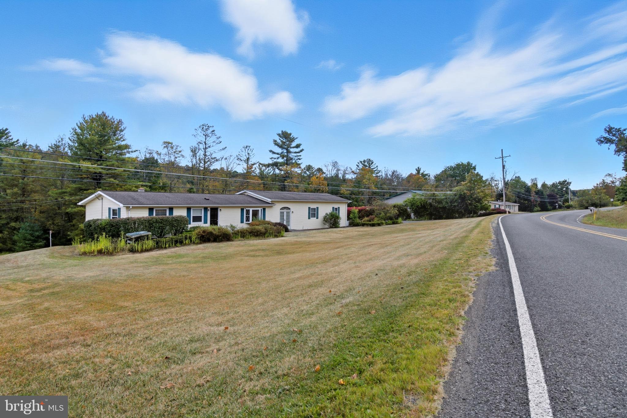 a view of a house with a yard