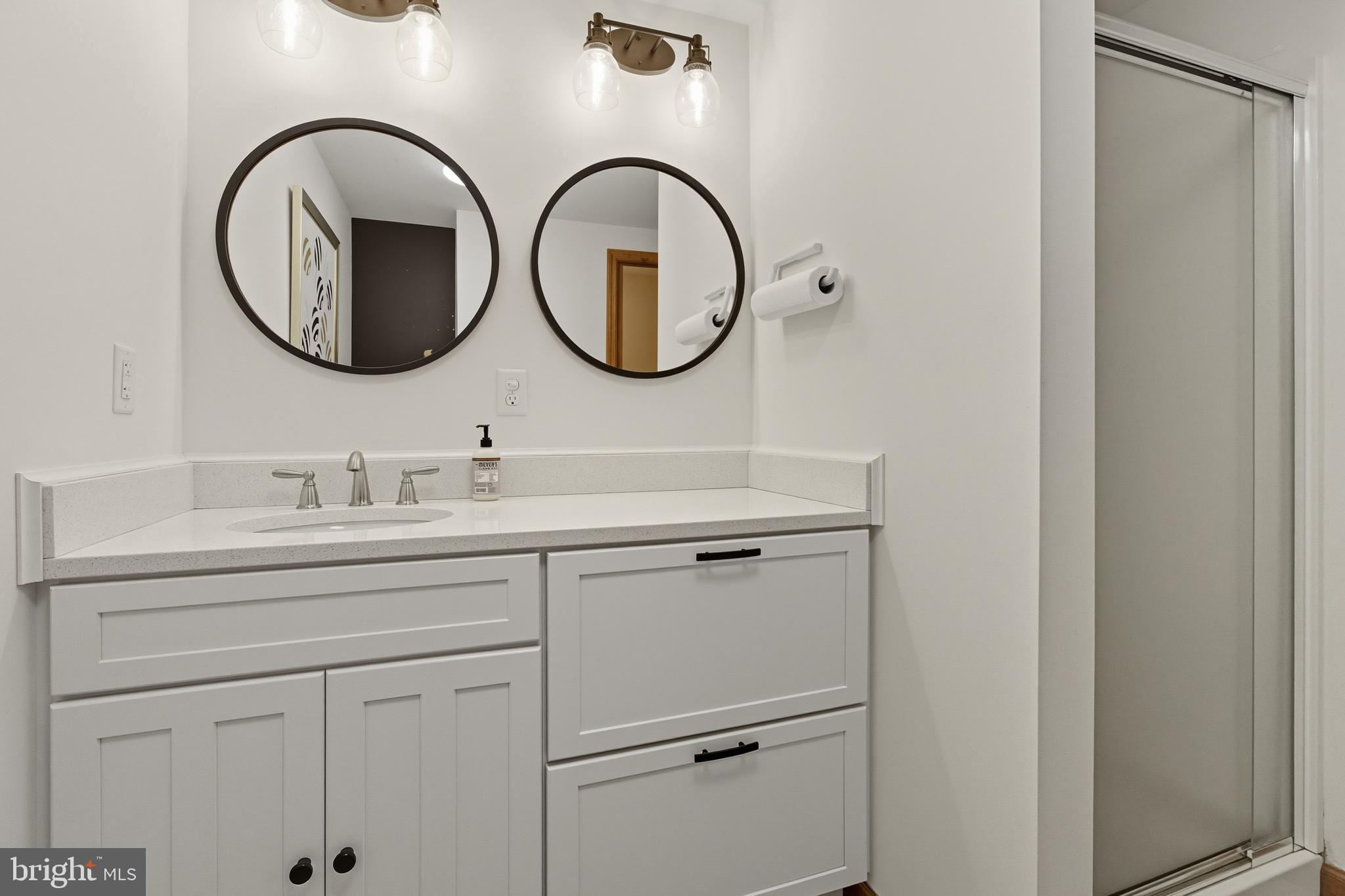 1532 Clarence Road Clarence, PA 16829 - Photo 14 of 35 a bathroom with a sink and a mirror