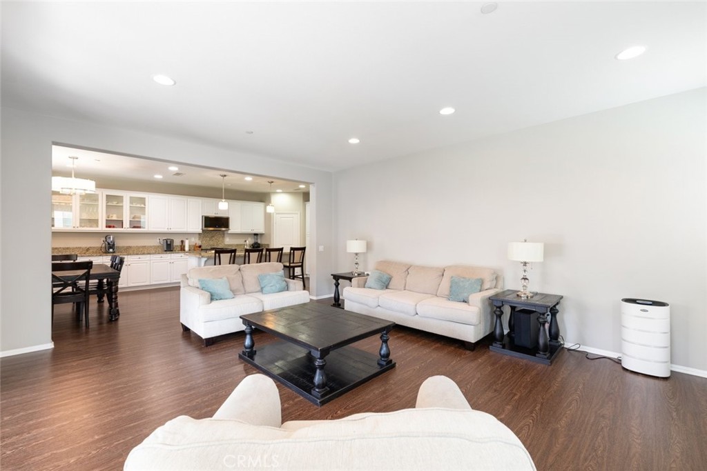 25451 Jack Rabbit Lane Corona, CA 92883 - Photo 18 of 75 a living room with furniture and a wooden floor