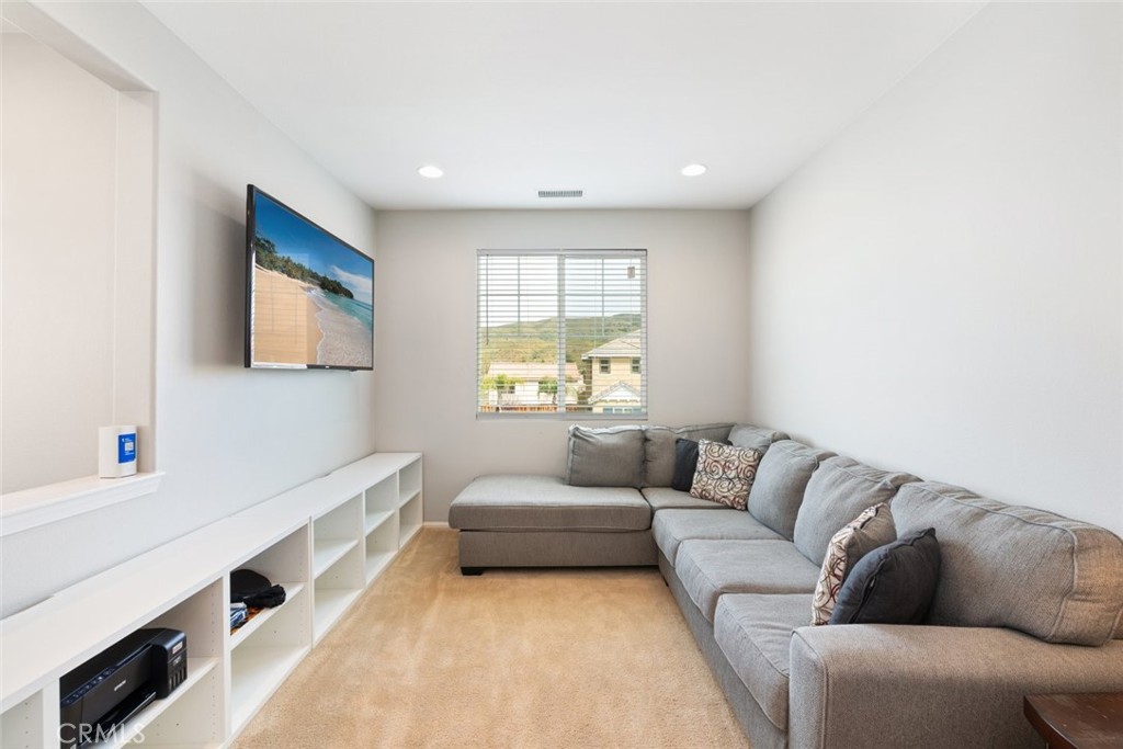 25451 Jack Rabbit Lane Corona, CA 92883 - Photo 24 of 75 a living room with furniture and a window