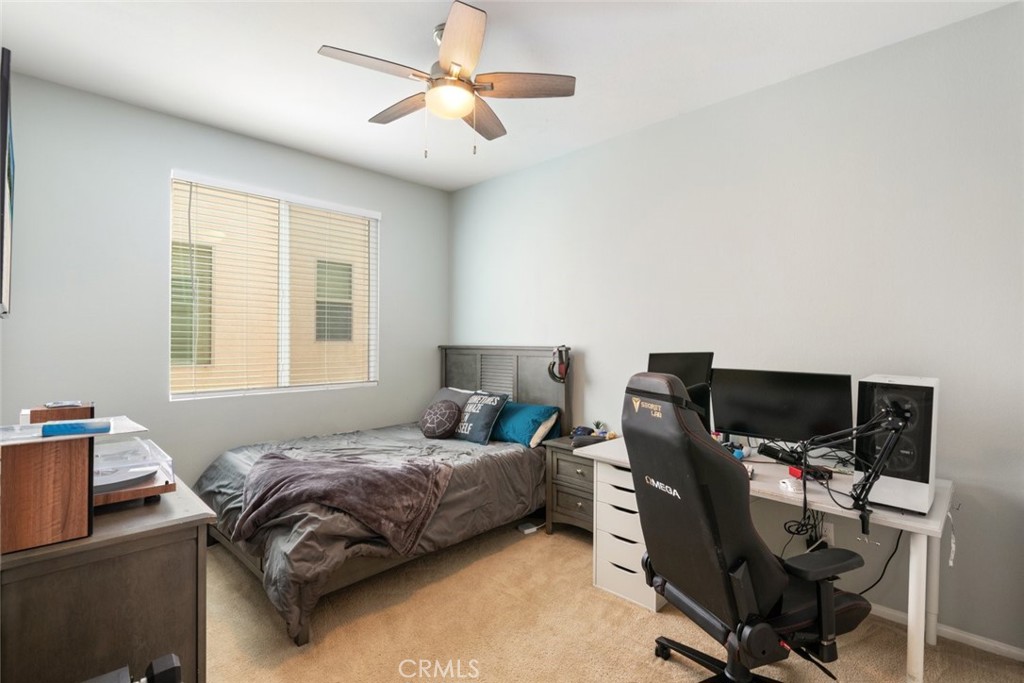 25451 Jack Rabbit Lane Corona, CA 92883 - Photo 27 of 75 a bedroom with a bed and a window