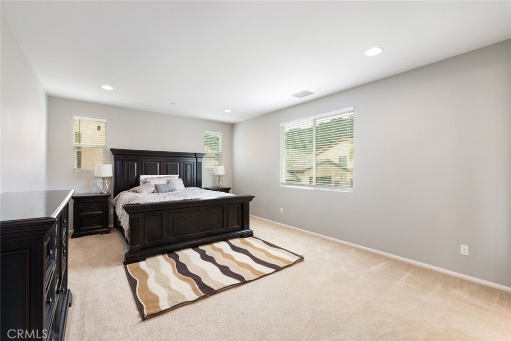 25451 Jack Rabbit Lane Corona, CA 92883 - Photo 29 of 75 a bedroom with a bed and window