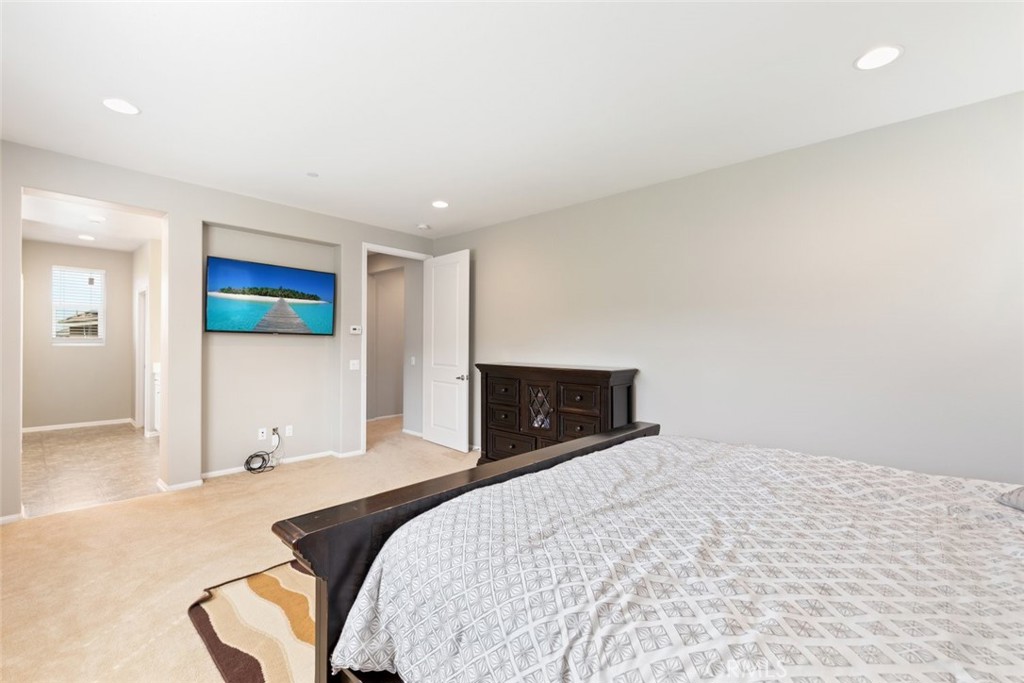 25451 Jack Rabbit Lane Corona, CA 92883 - Photo 30 of 75 a bedroom with a bed and a couch