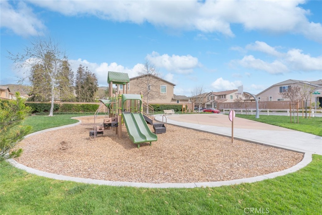 25451 Jack Rabbit Lane Corona, CA 92883 - Photo 47 of 75 a park view with a fountain in front of the house
