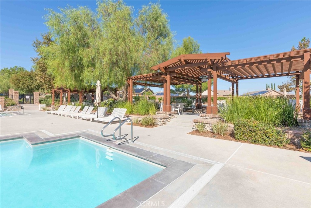 25451 Jack Rabbit Lane Corona, CA 92883 - Photo 62 of 75 a view of a swimming pool with a patio