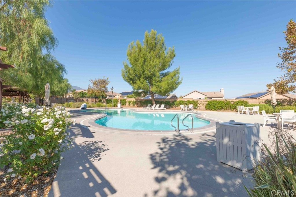 25451 Jack Rabbit Lane Corona, CA 92883 - Photo 64 of 75 a view of a swimming pool with a patio