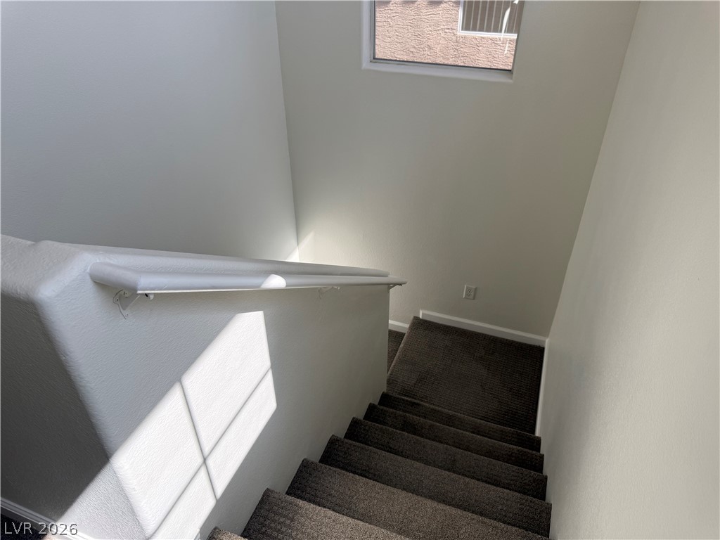 1141 Cathedral Ridge Street Henderson, NV 89052 - Photo 62 of 77 This staircase provides a clear path to the lower level of the home.