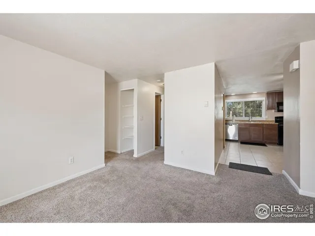 a view of a livingroom with furniture and an entryway