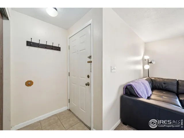 a living room with furniture and a walk in closet