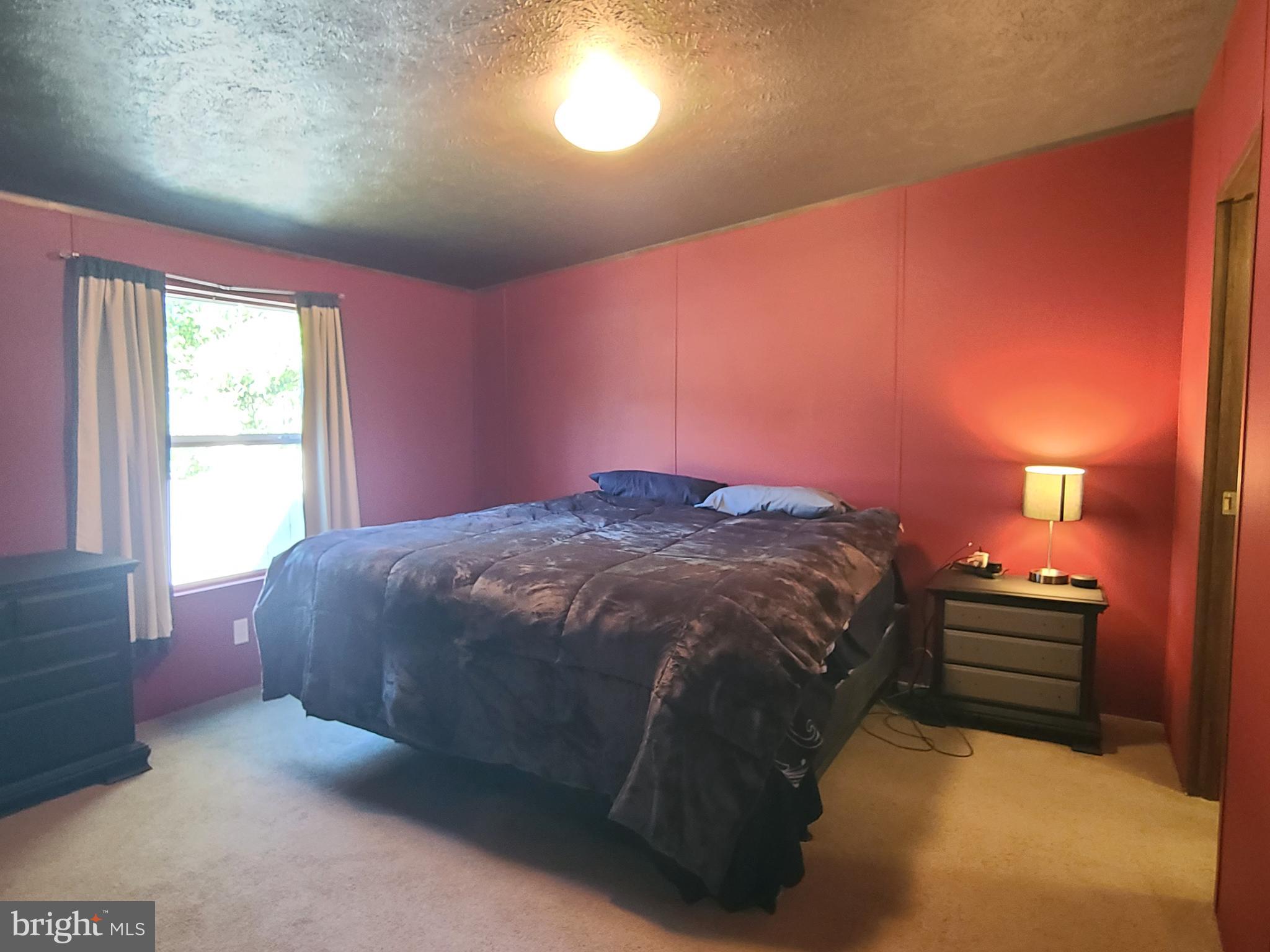 216 Meadow Trail Delta, PA 17314 - Photo 13 of 31 a bed sitting in a room next to a window