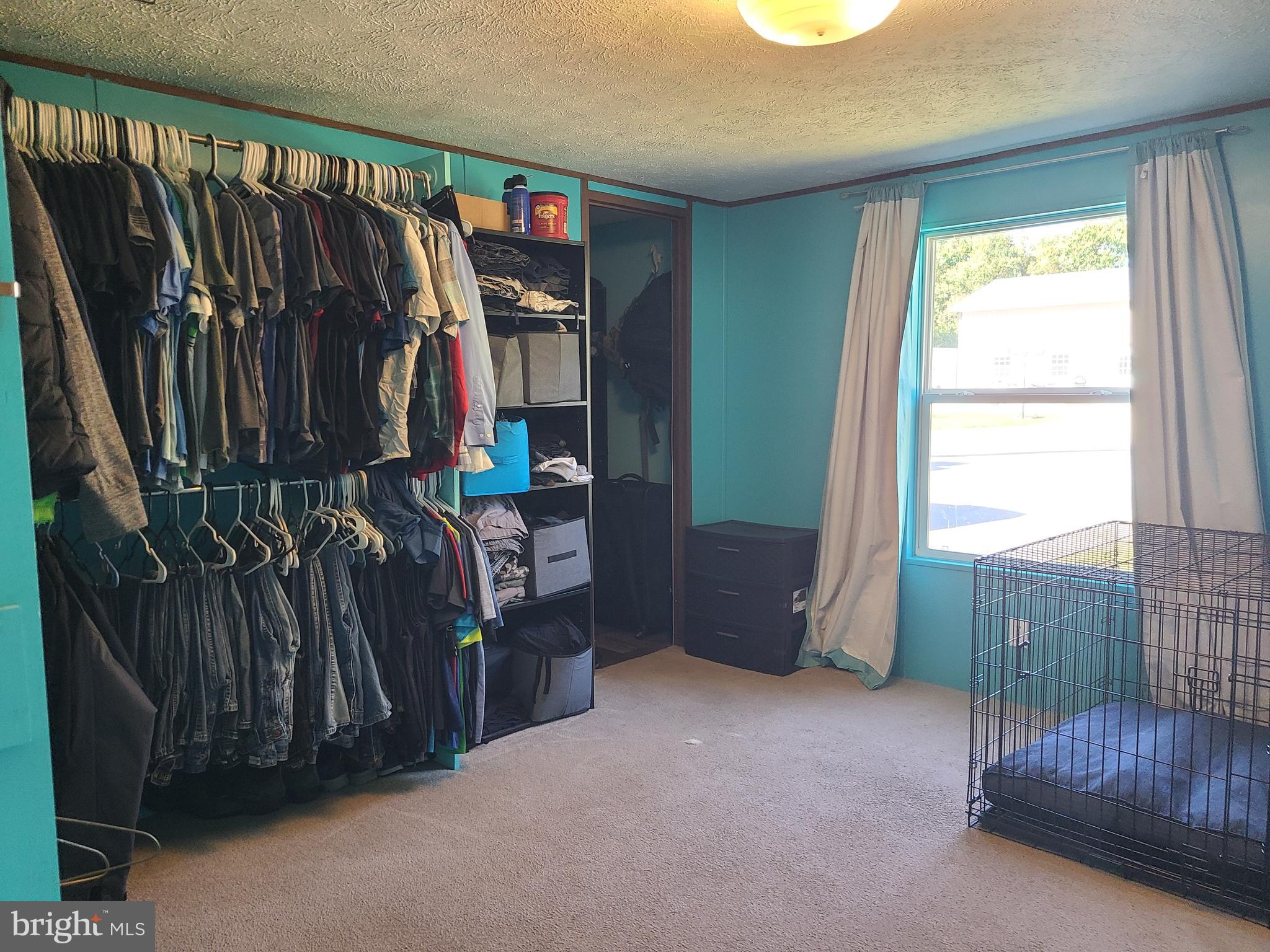 216 Meadow Trail Delta, PA 17314 - Photo 19 of 31 a view of walk in closet with clothes