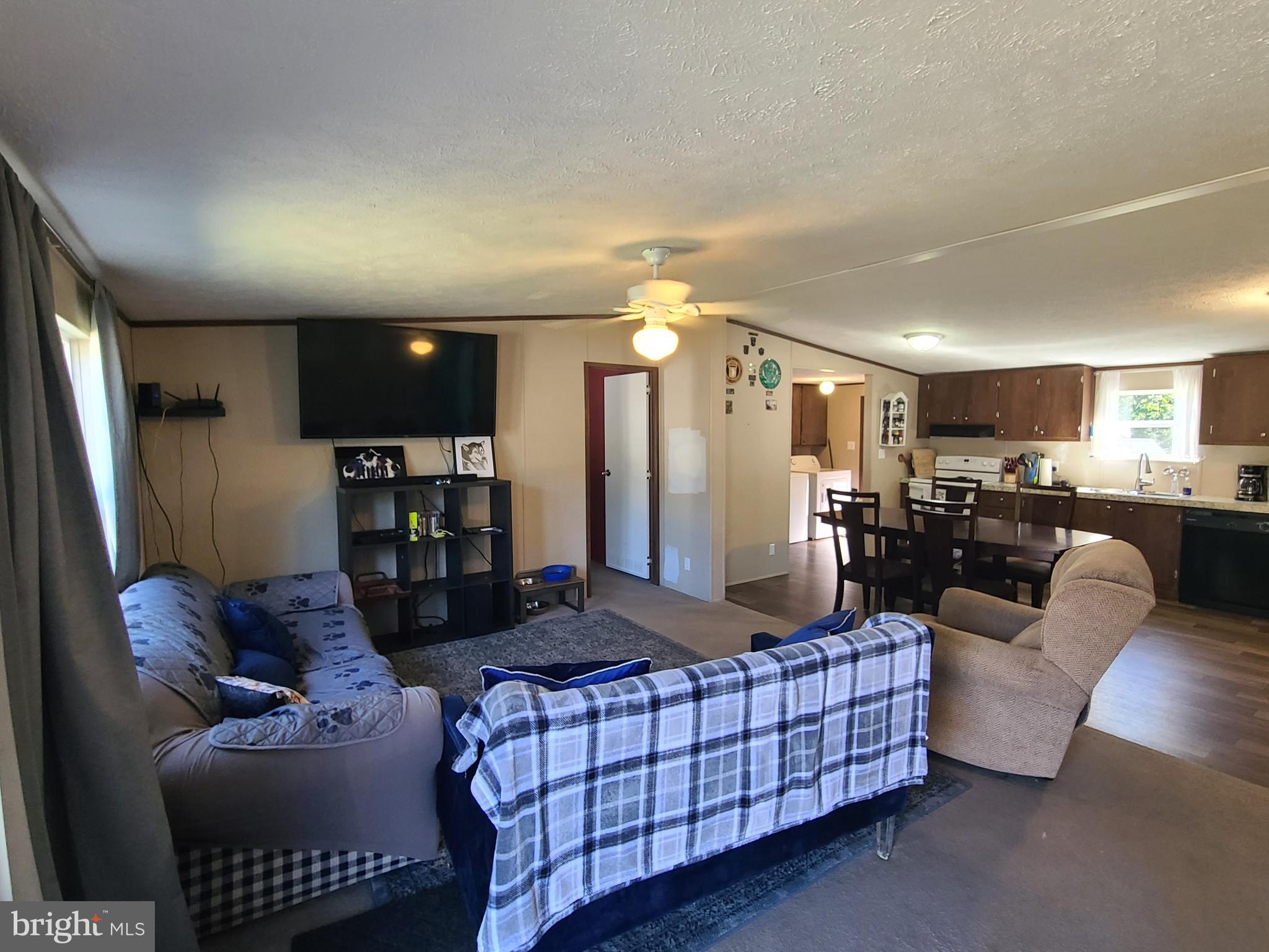 216 Meadow Trail Delta, PA 17314 - Photo 7 of 31 a living room with furniture and a view of kitchen