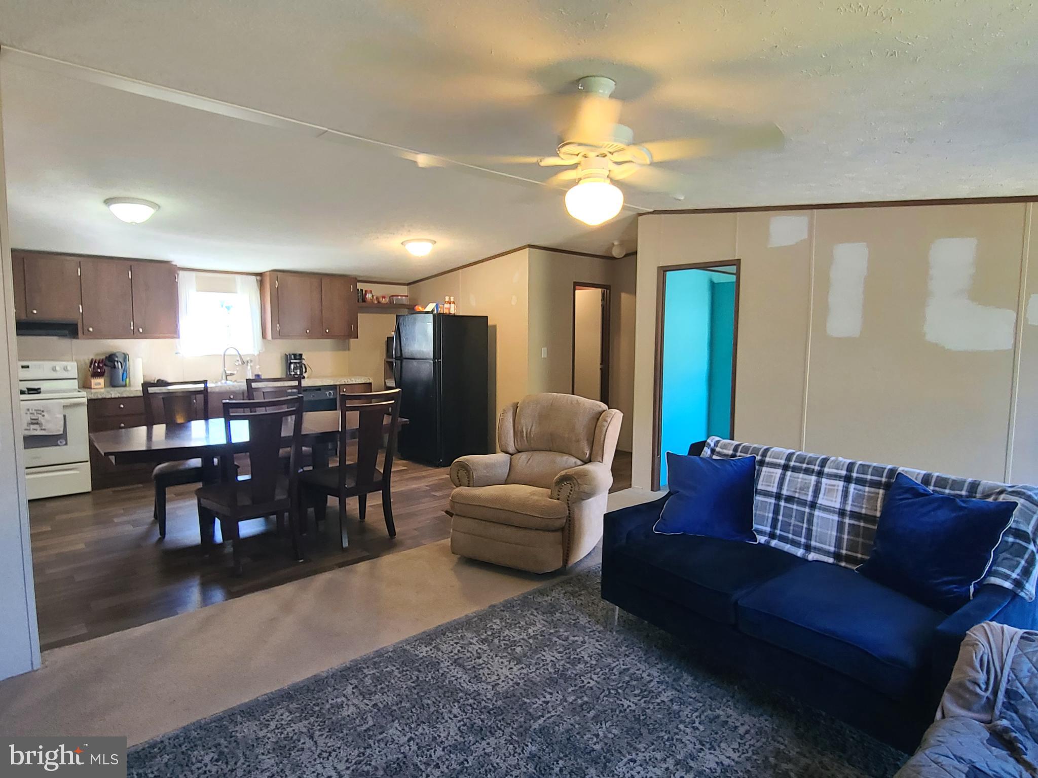 216 Meadow Trail Delta, PA 17314 - Photo 8 of 31 a living room with furniture kitchen and a dining table