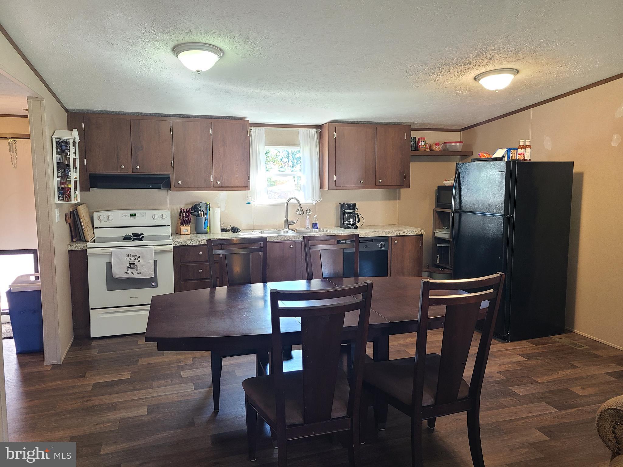 216 Meadow Trail Delta, PA 17314 - Photo 9 of 31 a kitchen with a dining table and chairs