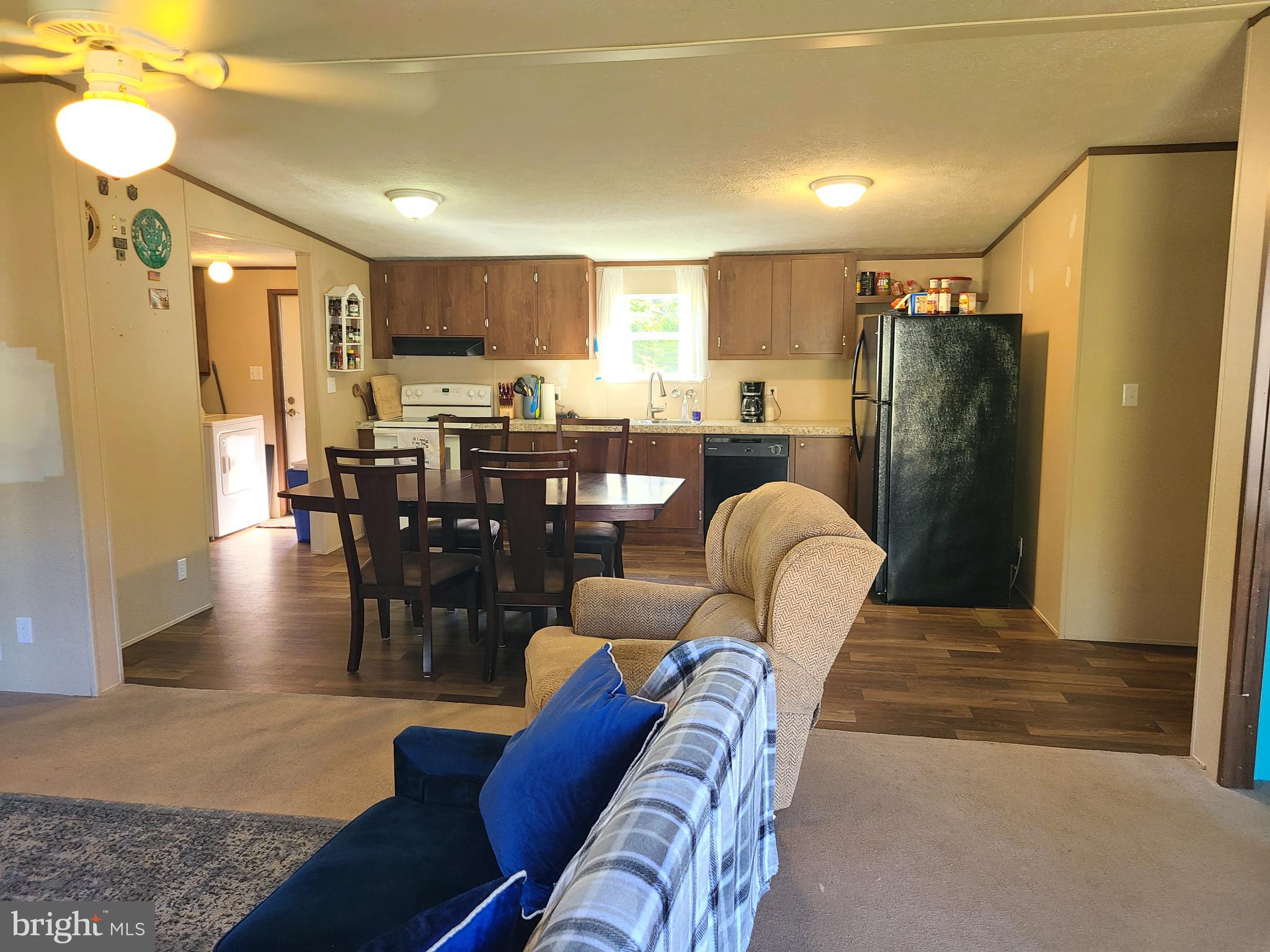 216 Meadow Trail Delta, PA 17314 - Photo 10 of 31 a living room with furniture dining table and wooden floors