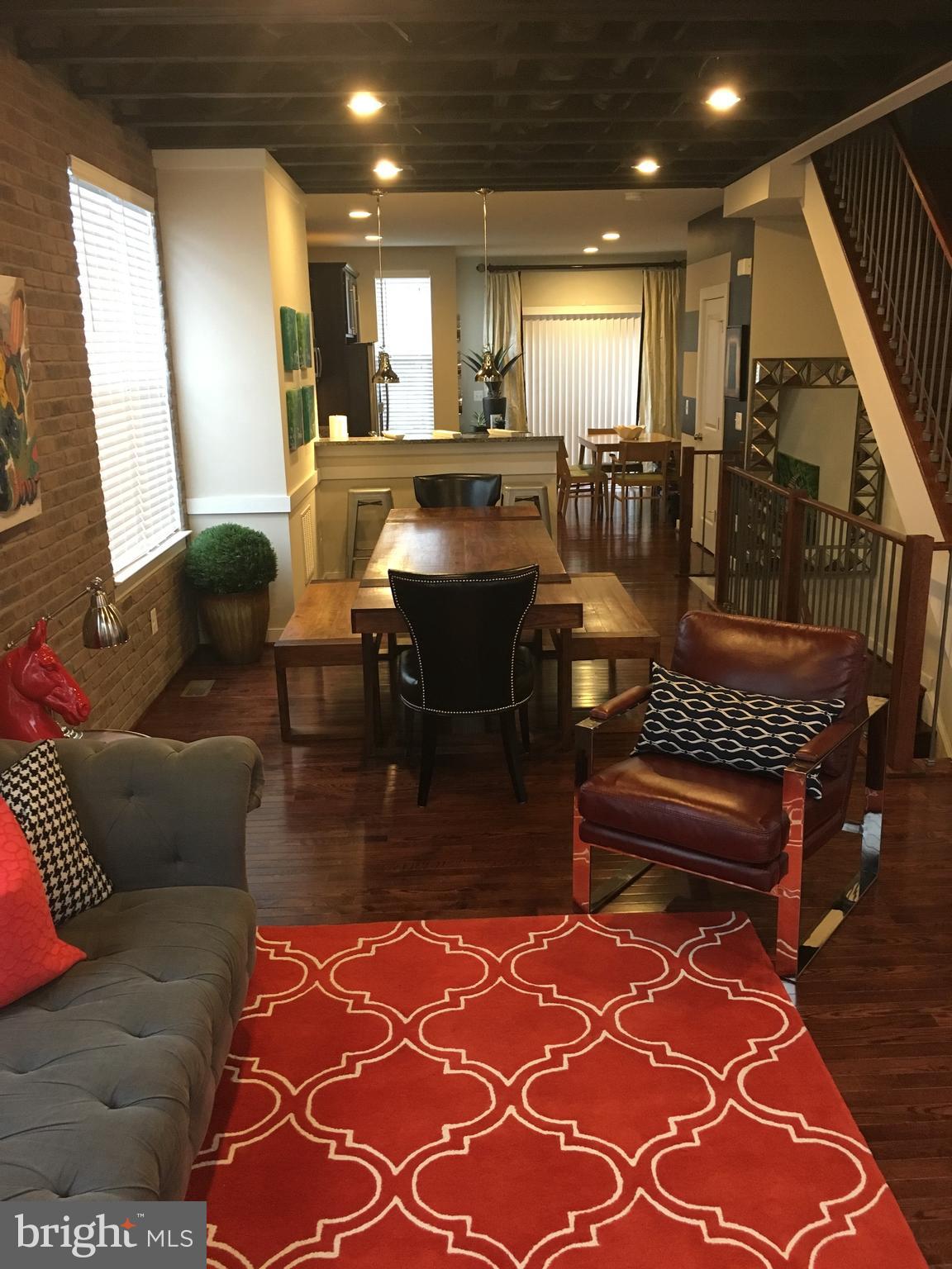 218 Shamrock Drive, Unit 3092 Stafford, VA 22556 - Photo 2 of 2 a living room with lots of furniture and a rug