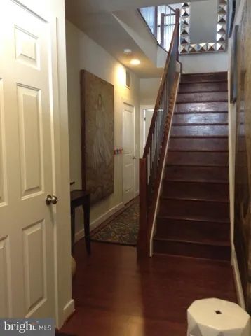a view of entryway with wooden floor