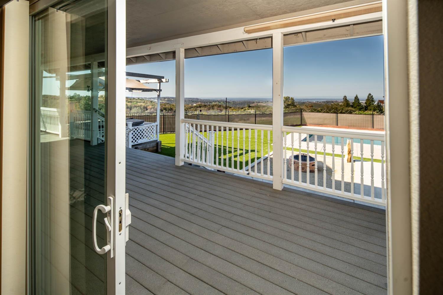 2661 Mountain Oak Lane Rescue, CA 95672 - Photo 27 of 87 Slider leading to back porch and fence backyard with gorgeous lake views