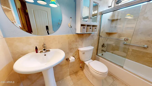 a view of a hallway with wooden shelves