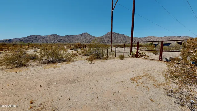 a view of backyard with a table and chairs