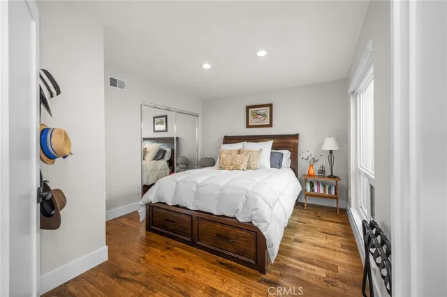 a bedroom with a bed and dresser