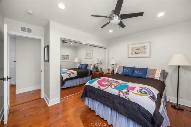 a bedroom with bed and a view of bedroom