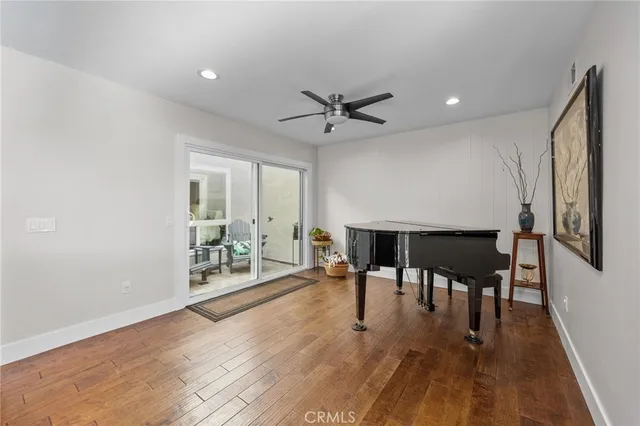 a view of a livingroom with furniture and hardwood floor