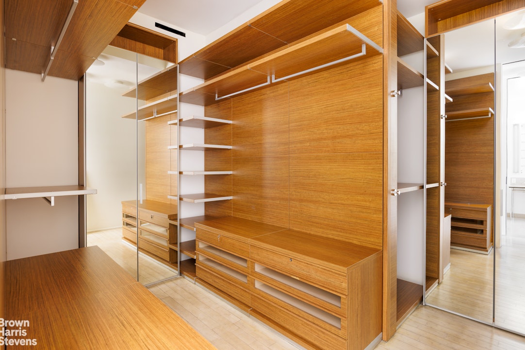 129 Greene Street, Unit 2 Manhattan, NY 10012 - Photo 7 of 12 a view of walk in closet with empty racks