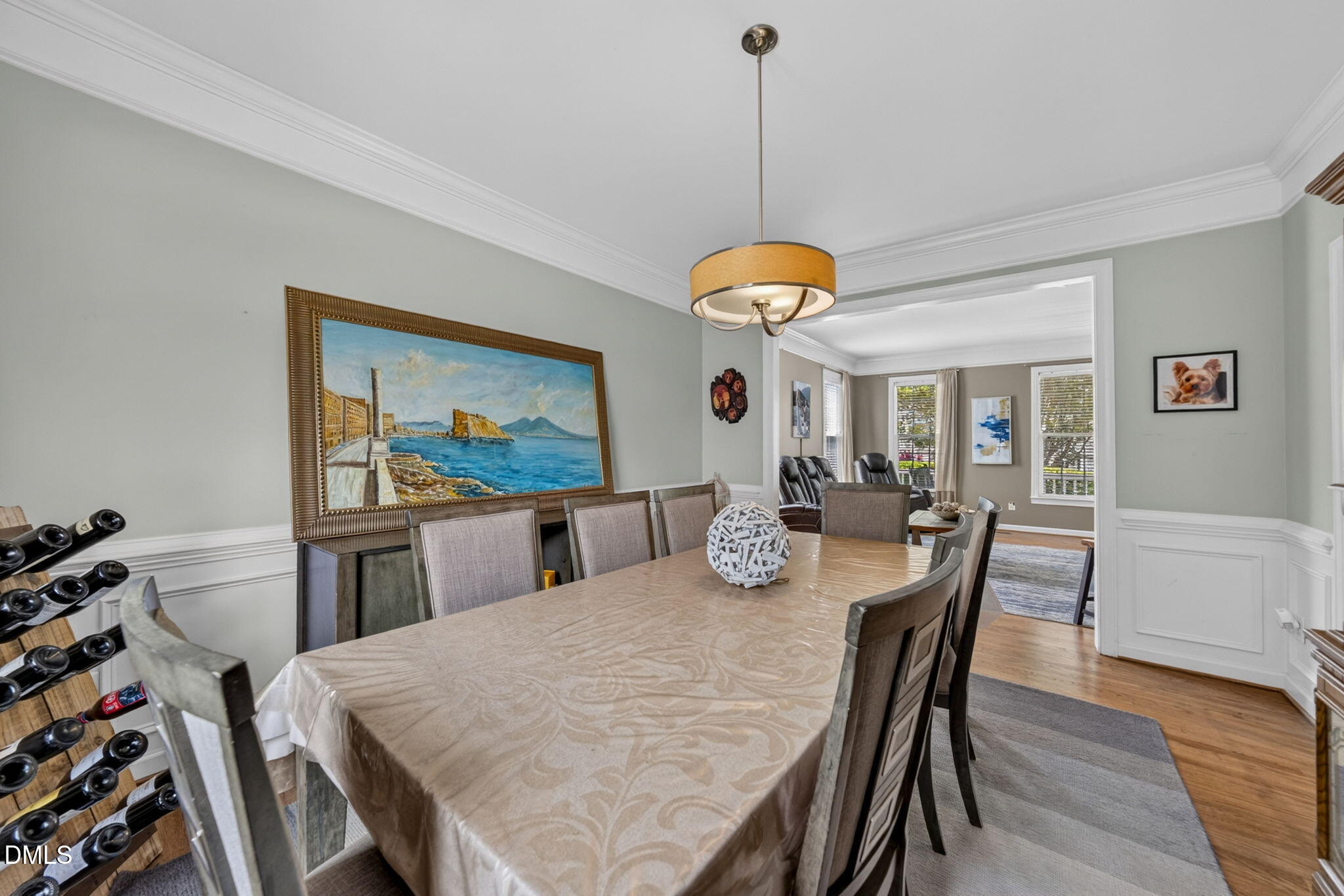 1258 Horsham Way Apex, NC 27502 - Photo 10 of 32 a view of a dining room with furniture wooden floor and chandelier