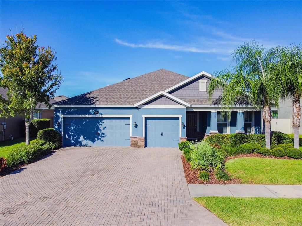 2011 Fox Grape Loop Lutz, FL 33558 - Photo 1 of 1 a front view of a house with a yard and garage